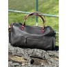 Tooled leather duffel bag