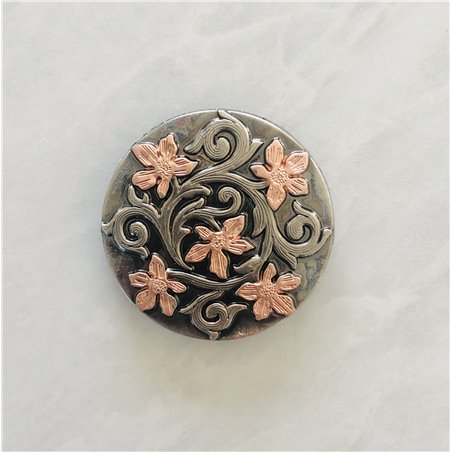 Silver scroll and copper flower concho